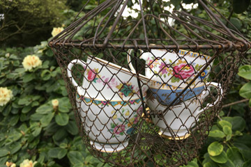 Porcelain in wire basket